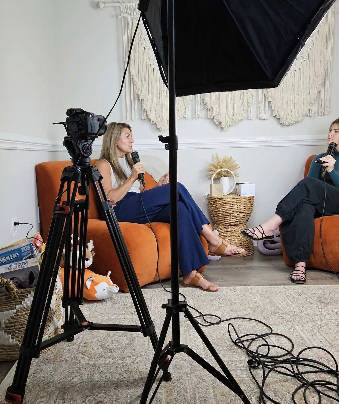Lisa Rowe recording a Rooted and Restored podcast conversation with a guest