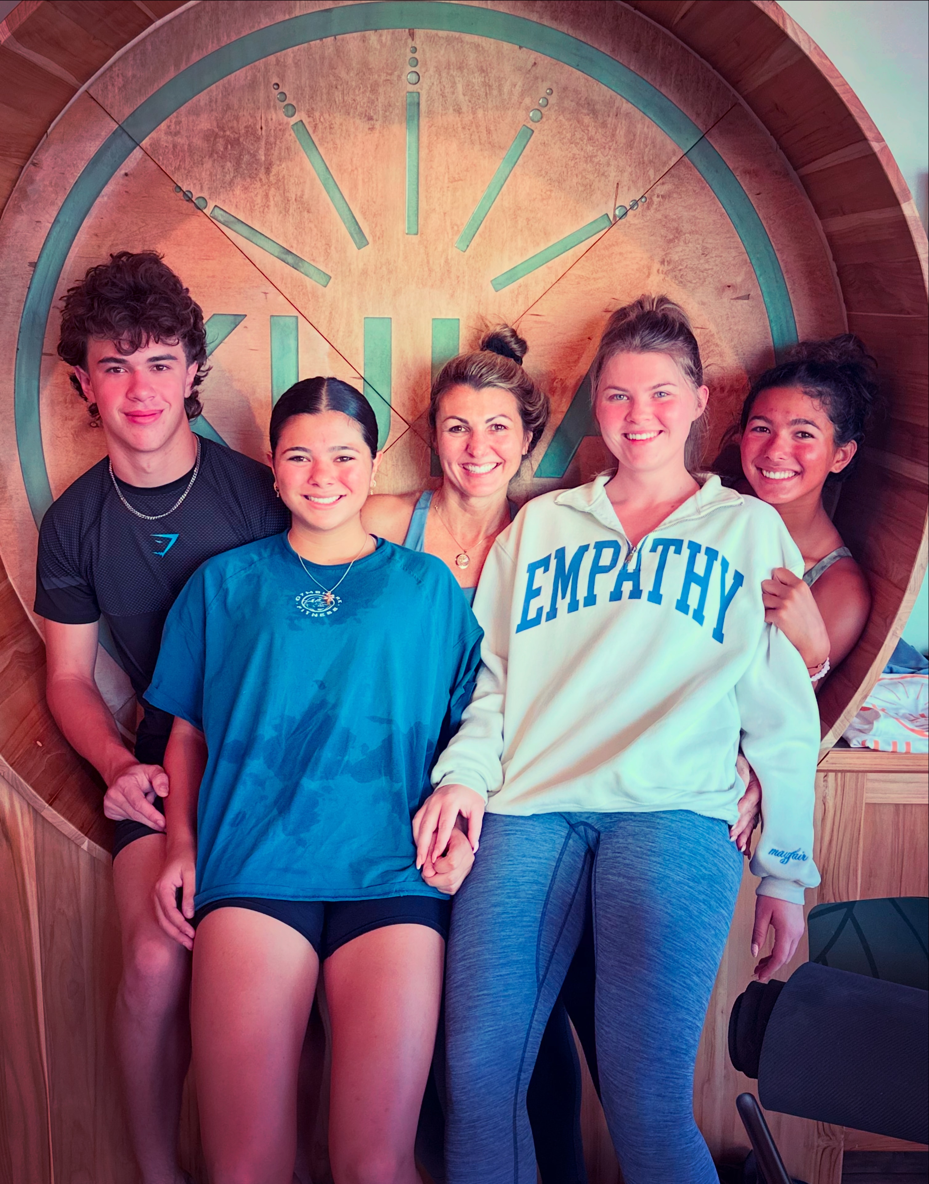 Lisa Rowe with family and friends in a warm group portrait