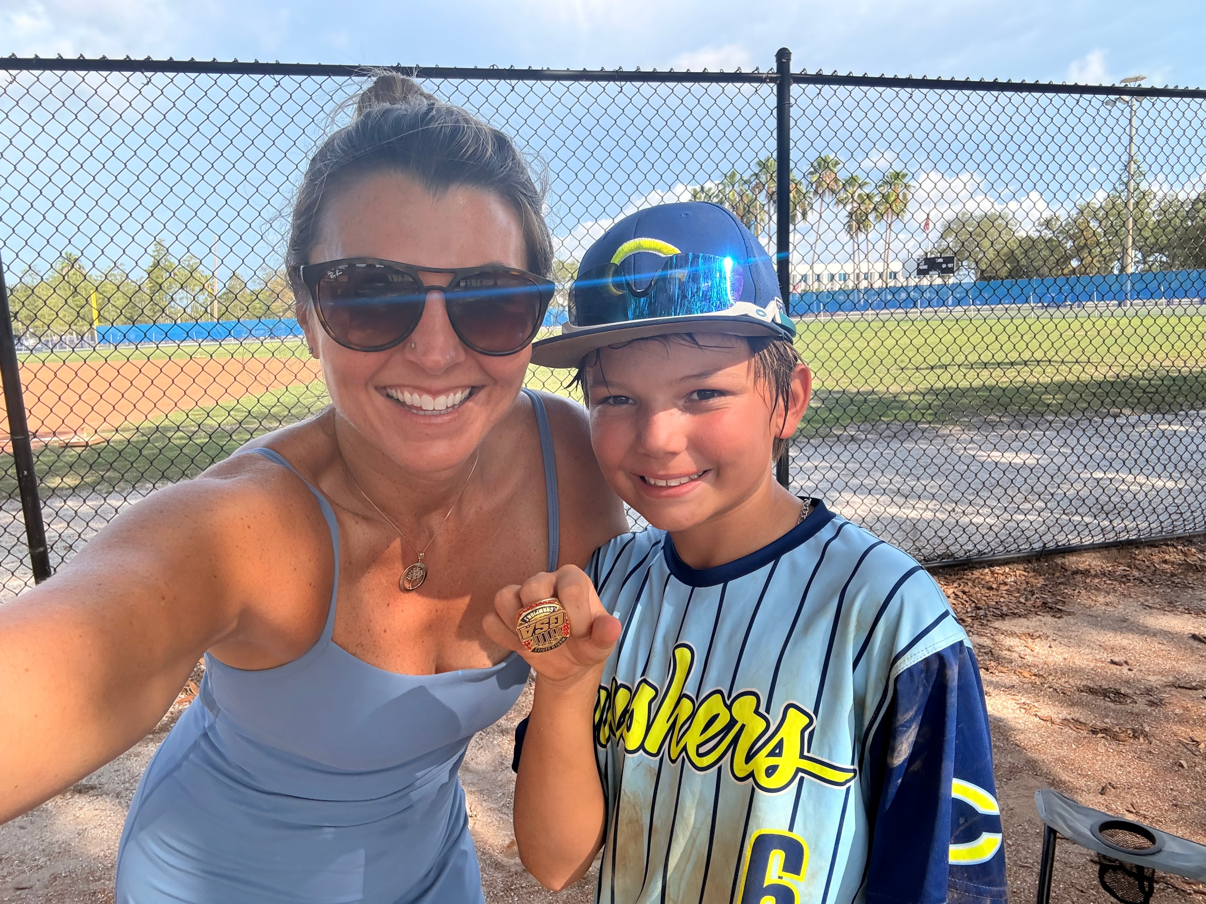 Lisa Rowe celebrating a baseball championship with her son